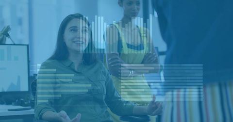 Business Team Collaborating with Digital Financial Graphics in Office