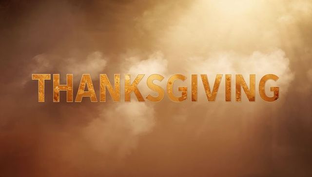 Shimmering Golden THANKSGIVING Lettering with Sunbeams and Cloud Mist