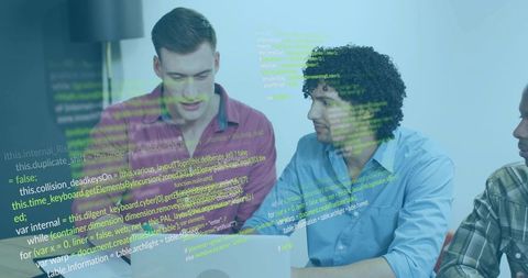 Developers collaborating over laptop with code overlay in modern workspace