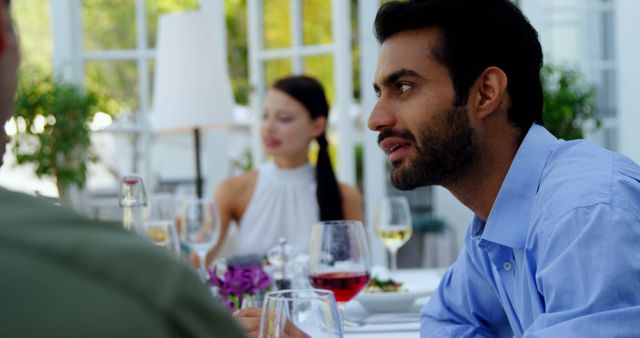 Young Professionals Having Business Lunch Conversation at Restaurant - Download Free Stock Images Pikwizard.com