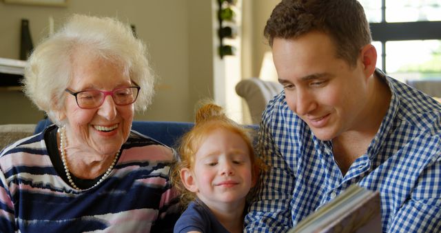 Happy Multi-Generational Family Reading Together at Home - Download Free Stock Images Pikwizard.com