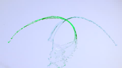 Dynamic Water Splash in Vivid Colors on Blue Background