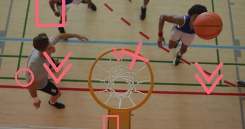 Overhead basketball action on indoor court