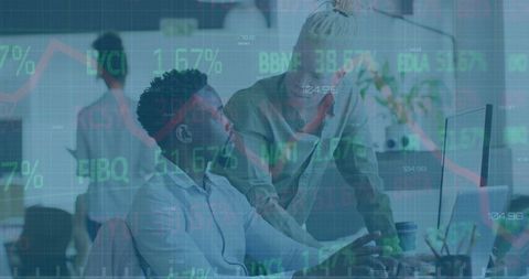 Diverse Coworkers Discussing Financial Data in Modern Office