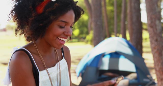 Joyful Woman Messaging on Mobile Phone During Outdoor Adventure - Download Free Stock Images Pikwizard.com