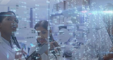 Scientists Analyzing Digital Data Panels in Modern Laboratory