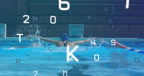 Athlete performing butterfly stroke in swimming pool lane
