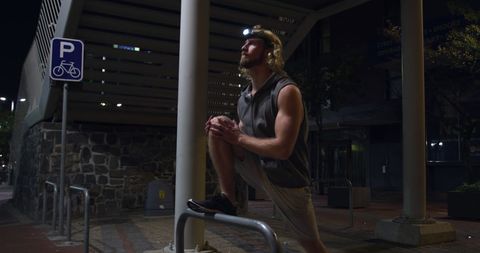 Evening Outdoor Exercise in City by Young Athletic Male