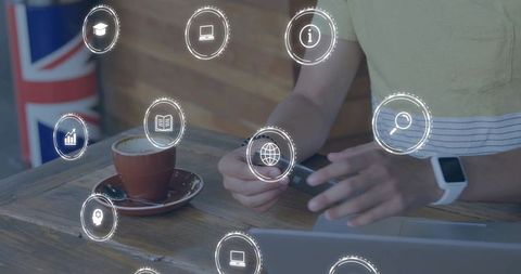 Man Connecting USB Dongle at Café with Laptop and Coffee, Remote Work Productivity Concept