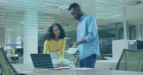 Coworkers Collaborating in Modern Office with Code Overlay