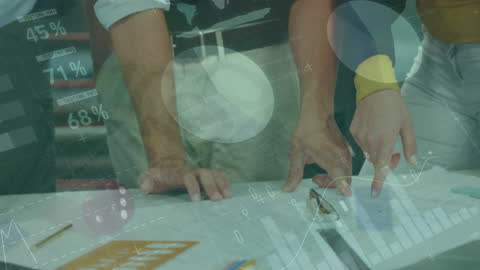 Collaborative Team Analyzing Business Reports with Data Visualizations