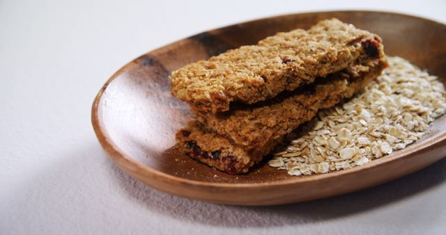 Healthy Granola Bars on Wooden Plate with Oats - Download Free Stock Images Pikwizard.com