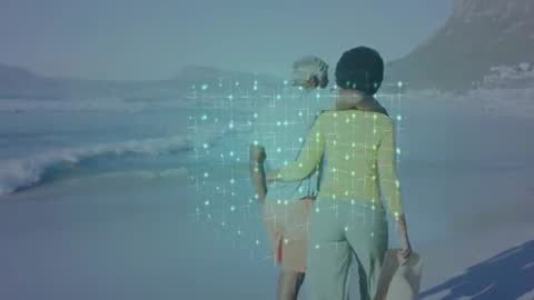 Couple Walking on Beach with Digital Overlay Symbolizing Connection and Innovation