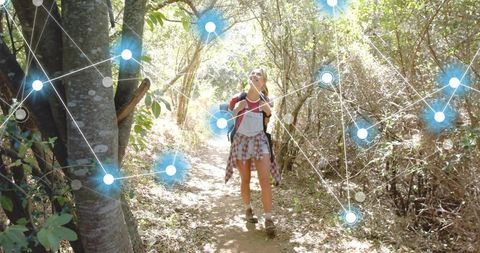Sunlit Forest Hiker Walking Trail Wearing Red Backpack, Plaid Shirt with Digital Network Overlay