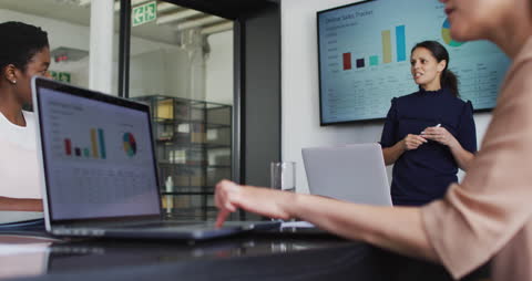 Diverse Women Engaged in Successful Business Presentation