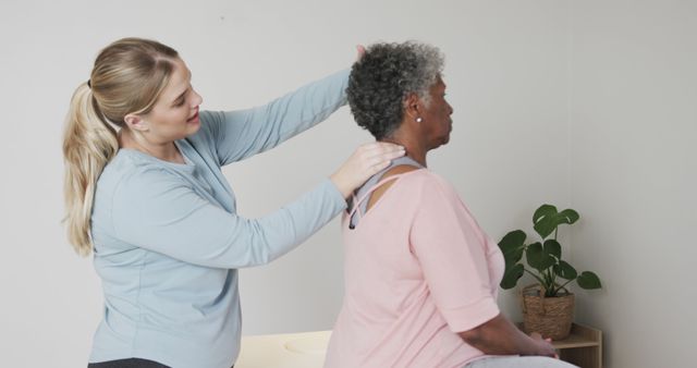 Young Chiropractor Treating Elderly Woman's Neck Pain in Clinic - Download Free Stock Images Pikwizard.com