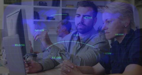 Team reviewing data on monitor with futuristic hud overlay for office collaboration