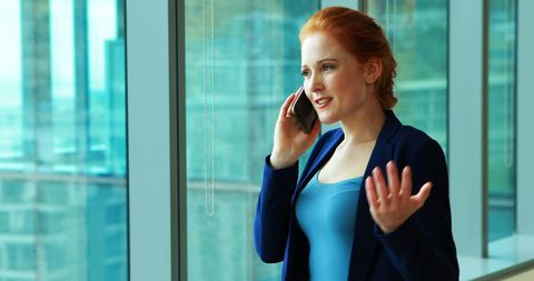 Confident Female Executive Speaking on Phone in Office Setting
