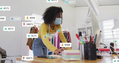 Professional Designer Engaging in Creative Workspace with Technology Icons Overlay