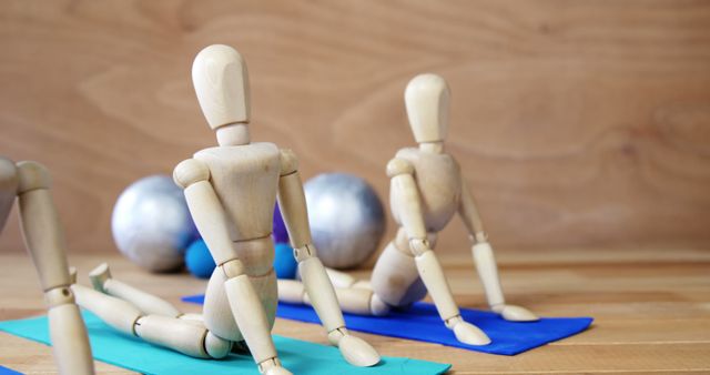 Wooden Mannequins Practicing Yoga on Mats in Studio - Download Free Stock Images Pikwizard.com