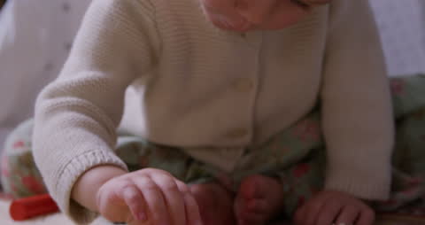 Curious Toddler Playing with Colorful Wooden Blocks Indoors