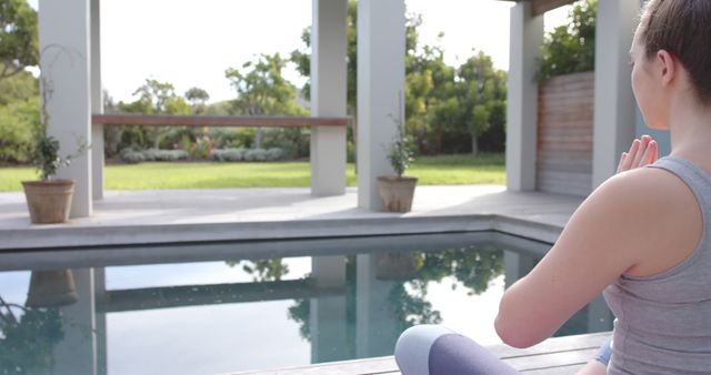 Woman Practicing Yoga by Outdoor Pool in Serene Garden - Download Free Stock Images Pikwizard.com