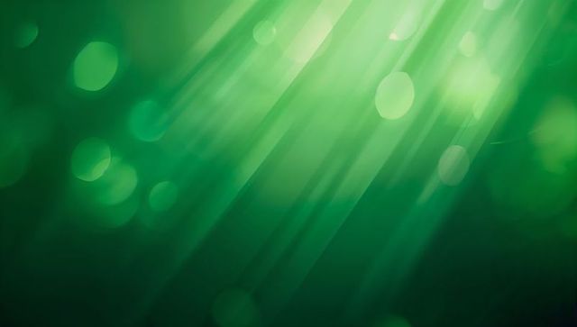 Emerald light beams crossing diagonal bokeh background for nature and technology design
