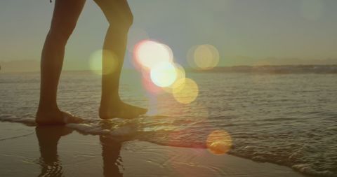 Serene Beach Walk with Dreamlike Lens Flares at Sunset - Download Free Stock Images Pikwizard.com