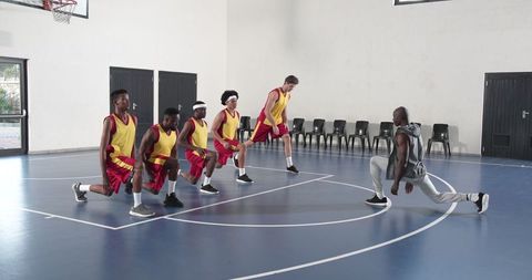 Basketball Team Engaged in Dynamic Group Training Session
