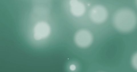 Glowing green abstract light spots background