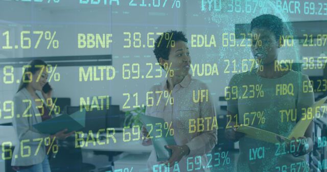 Business professionals analyzing stock market data displayed on a screen. Lights create a modern, high-tech office environment. Great for illustrations on financial forecasts, technology in business, investment strategies, market analysis.