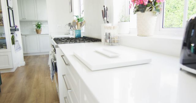 Image of modern, luxury domestic kitchen with white units and wooden floor, copy space - Download Free Stock Photos Pikwizard.com