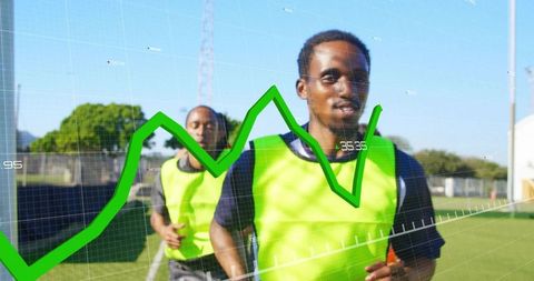 Sprinting athletes wearing neon bibs with real-time performance data overlay on turf field