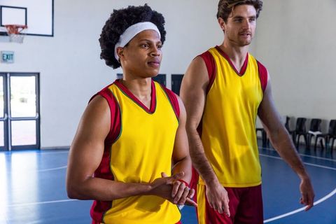 Confident Basketball Teammates Preparing for Match