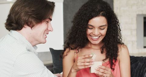 Joyful Couple Celebrating Anniversary with Gifts