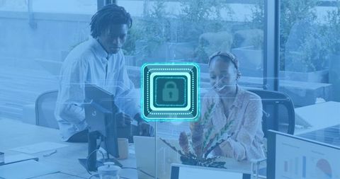 Office team collaborating on cybersecurity working on laptops with digital lock overlay