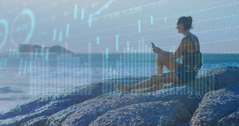Woman on Beach Accessing Financial Data Digitally