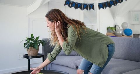 Woman Preparing Homemaking Party, Putting Wine on Table