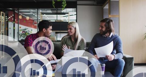 Diverse Team Collaborating in Modern Office with Media Digital Overlay