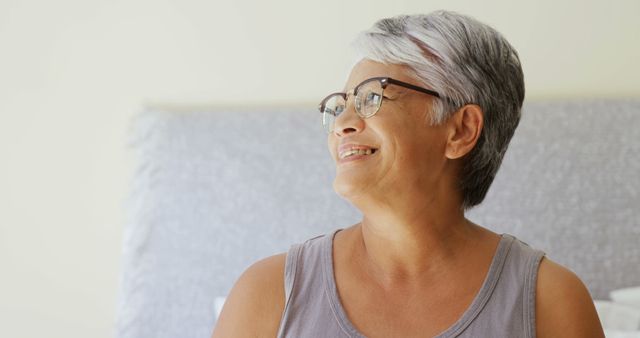 Happy Older Woman Smiling in Bright Room - Download Free Stock Images Pikwizard.com