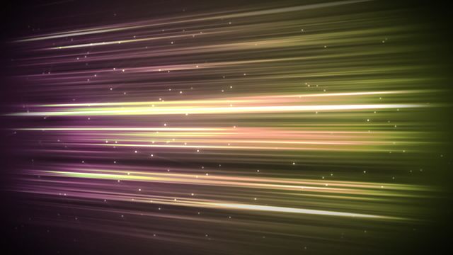 Colorful light streaks moving horizontally with white specks floating in the foreground. Useful for futuristic and energetic designs, perfect for video backgrounds, presentations, and digital art projects enhancing dynamic and modern themes.