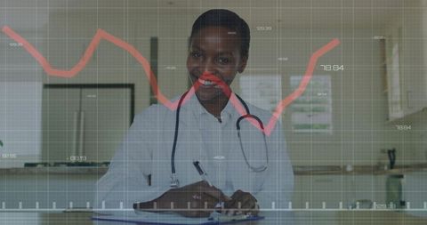 Smiling clinician writing on clipboard wearing stethoscope with healthcare data overlay