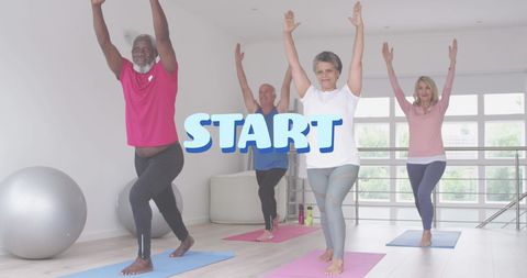 Mature adults practicing yoga for wellness in bright studio