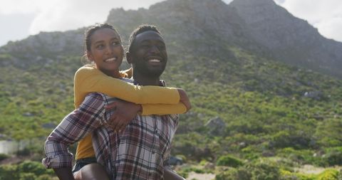 Couple Enjoying Outdoor Adventure with Mountain View