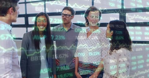 Team Collaborating in Office with Stock Market Data Overlay