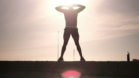 Athlete Doing Squats Outdoors in Sunset Lighting