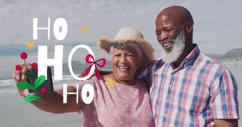 Senior Couple Celebrating Christmas with Beach Selfie