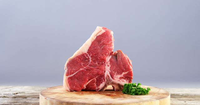 Raw T-Bone Steak on Wooden Cutting Board with Fresh Parsley - Download Free Stock Images Pikwizard.com