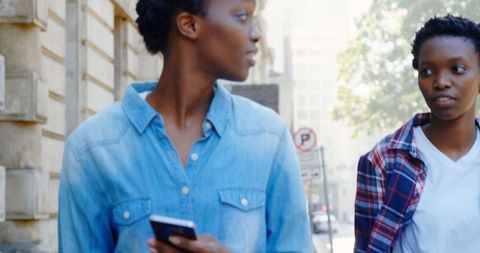 Urban African American Twin Sisters Engaging with Mobile Phone - Download Free Stock Images Pikwizard.com