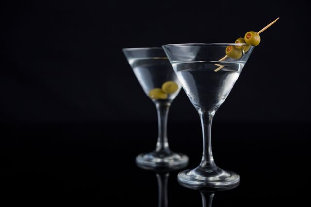 Cocktail martini with olives on table - Download Free Stock Photos Pikwizard.com